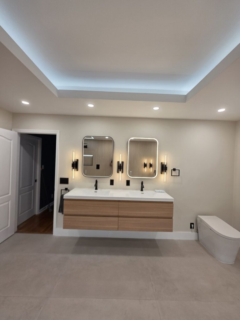 Bathroom after the remodel: floating vanity and LED tray ceiling