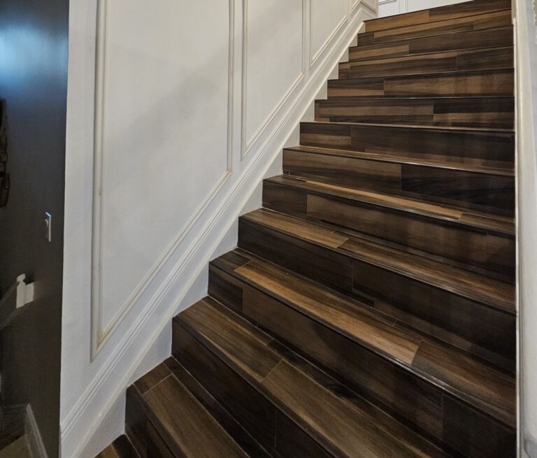 Staircase with full-height picture-frame molding
