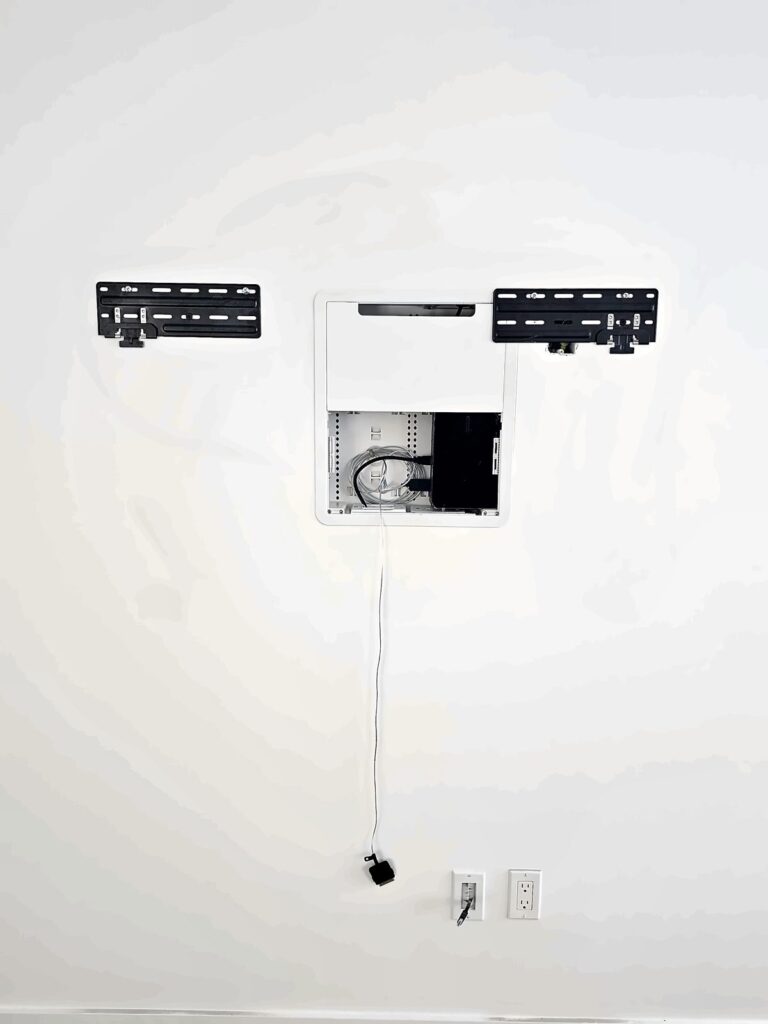 Wall with a TV mount before the TV goes up